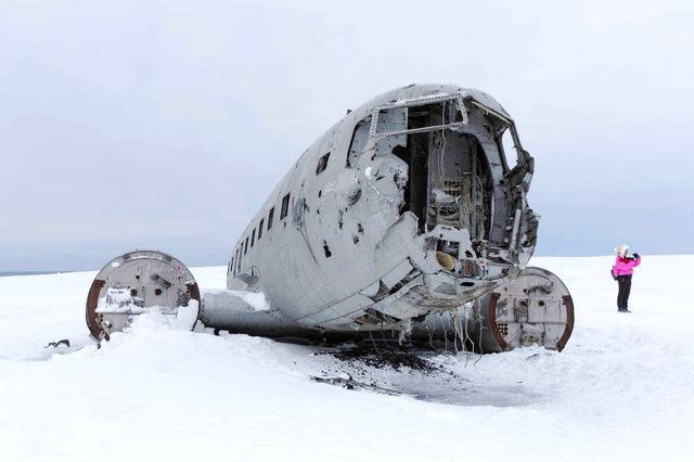 The wreckage of an airplane at the end of the world.