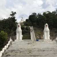 huge white Buddha overlooking the city of Pai