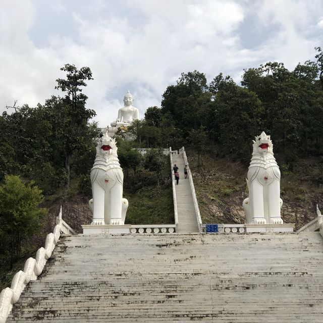 huge white Buddha overlooking the city of Pai