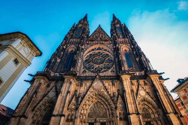 View St. Vitus Cathedral through the colorful stained glass windows.