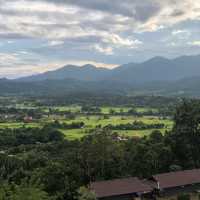 huge white Buddha overlooking the city of Pai