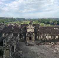 Climbing the tower of Angkor Wat