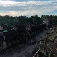 Climbing the tower of Angkor Wat