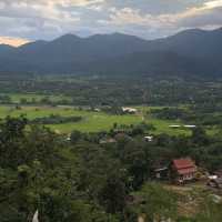 huge white Buddha overlooking the city of Pai