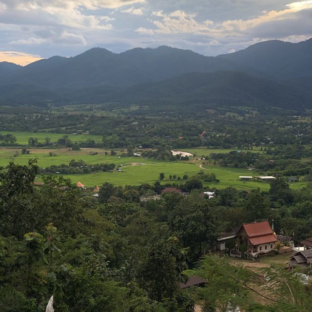 huge white Buddha overlooking the city of Pai