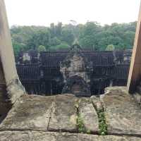 Climbing the tower of Angkor Wat