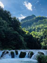 Blue water, tall mountains, many waterfalls!