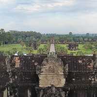 Climbing the tower of Angkor Wat