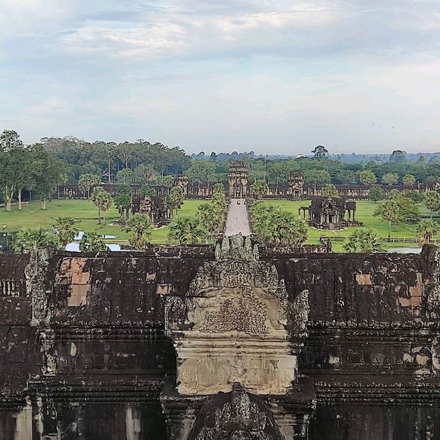 Climbing the tower of Angkor Wat
