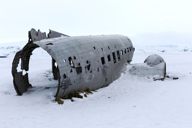 The wreckage of an airplane at the end of the world.