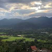 huge white Buddha overlooking the city of Pai