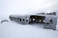 The wreckage of an airplane at the end of the world.