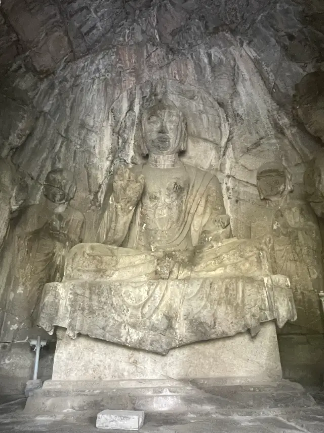 Headless Buddhas at Longmen Grottoes