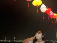 Colorful lantern next to the dark sea side