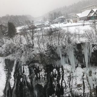 #bucketlistreboot

Shirahige Falls /Blue Pond Biei Hokkaido

During winter time the pond becomes White Pond. If one going during spring or summer or autumn , you can actually walked down the trail . But the day I went I think it’s a -6 and getting cold, hence went up to the bridge for photo instead.

Shirahige Falls stream down the cliff face into Biei River. Mount Tokachi, where the waters of Shirogane Hot Springs is sourced from, absorbs some of the water it catches down to become ground water over time. mixing with the minerals all the way from mount, it came out BLUE.
 Well, during winter , it’s so white so you need to stare very hard on the picture . Next to the bridge there is a place for hot spring . 
How to get there: Drive or Bus tour from Sapporo. I support the Bus tour. #greentravel