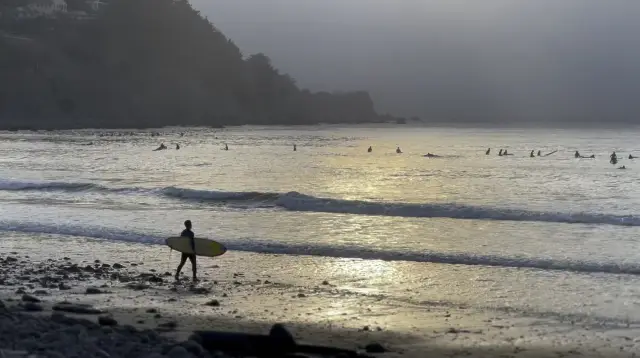 Surfing into the sunset in Pacifica