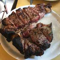 Eating Bistecca Fiorentina in Montepulciano