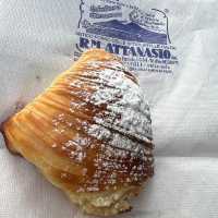 A sfogliatella and a box of pizza - Napoli