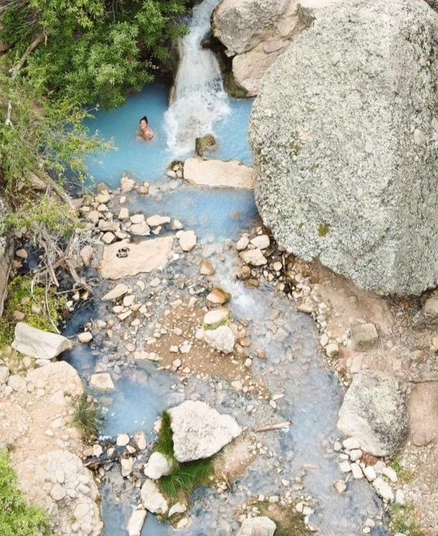 Soak in the ancient hot springs in the wilderness of Utah.