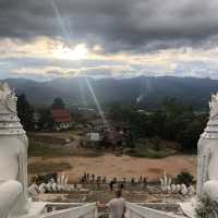 huge white Buddha overlooking the city of Pai