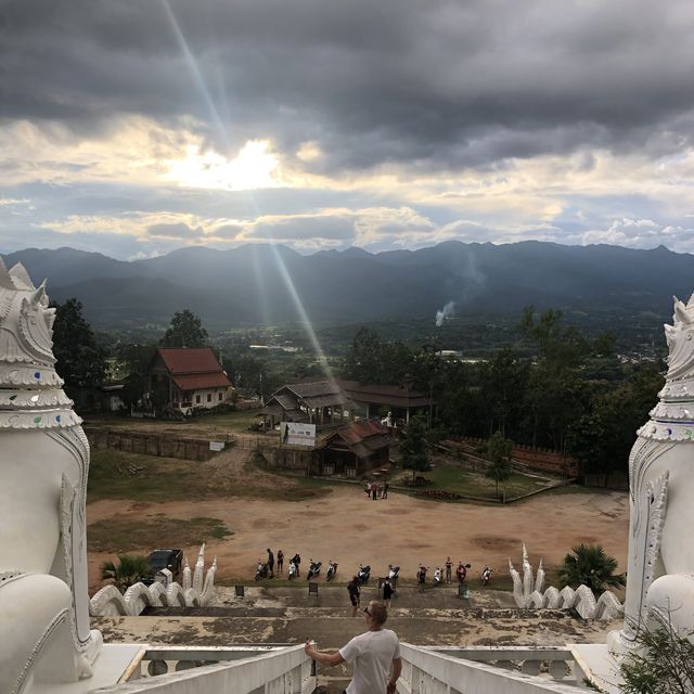 huge white Buddha overlooking the city of Pai