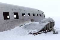 The wreckage of an airplane at the end of the world.