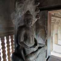 Climbing the tower of Angkor Wat