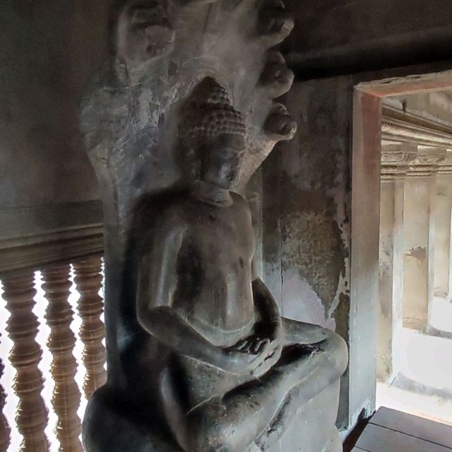 Climbing the tower of Angkor Wat