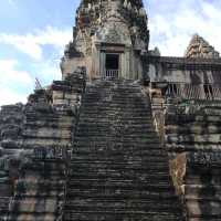 Climbing the tower of Angkor Wat