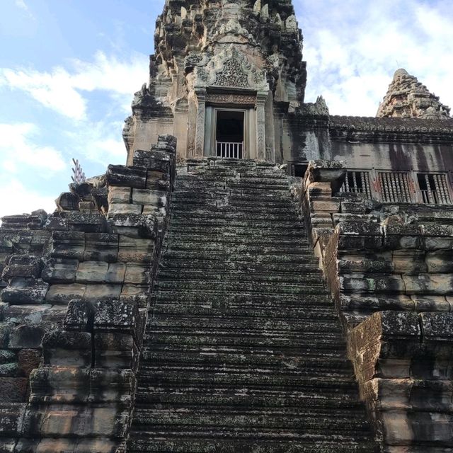 Climbing the tower of Angkor Wat