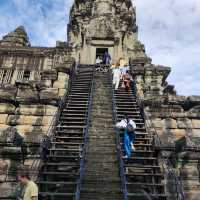 Climbing the tower of Angkor Wat