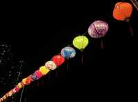 Colorful lantern next to the dark sea side