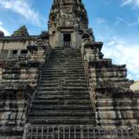 Climbing the tower of Angkor Wat