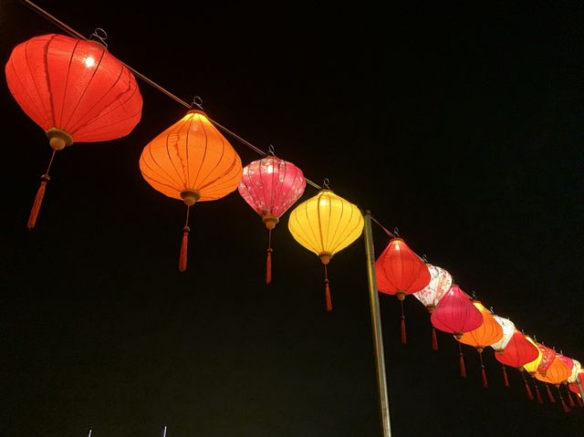 Colorful lantern next to the dark sea side