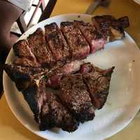 Eating Bistecca Fiorentina in Montepulciano