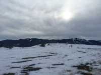 Wilderness church and snowy road scenery in the Bavarian Alps.