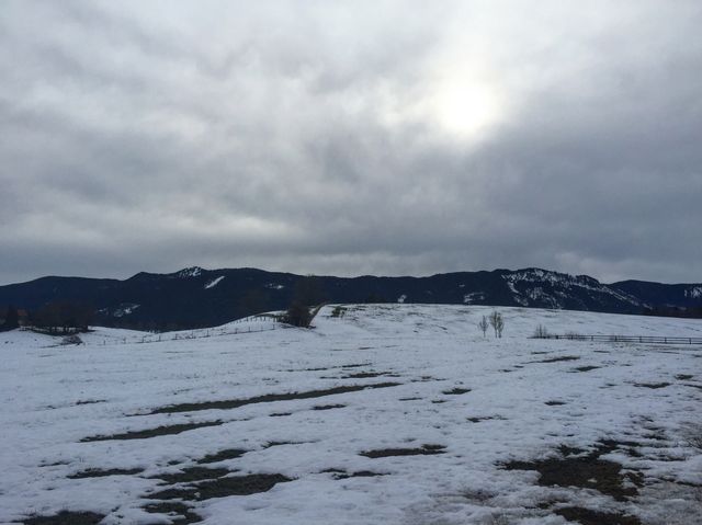 Wilderness church and snowy road scenery in the Bavarian Alps.