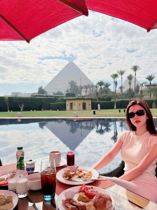 Have breakfast under the pyramid.