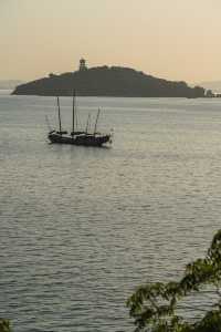 Fishing boats singing at dusk.