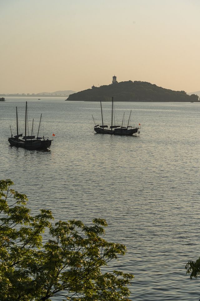 Fishing boats singing at dusk.