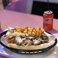 Eating comfort food in a car at Macau Studio City 