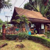 cute resort surrounded by palm trees 