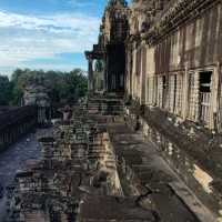 Climbing the tower of Angkor Wat
