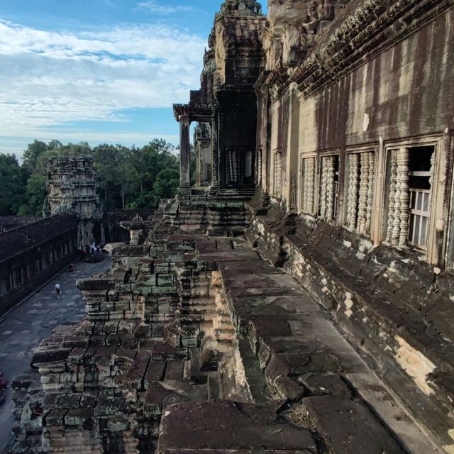 Climbing the tower of Angkor Wat