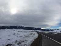 Wilderness church and snowy road scenery in the Bavarian Alps.