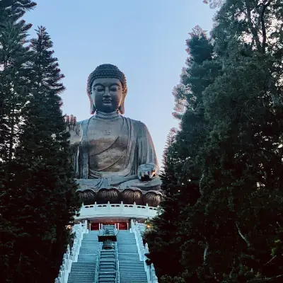 Buddha statue at Po Lin, Hong Kong. Bright light from hand. Stock Photo