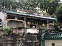 Historic temple with art work on the roof 