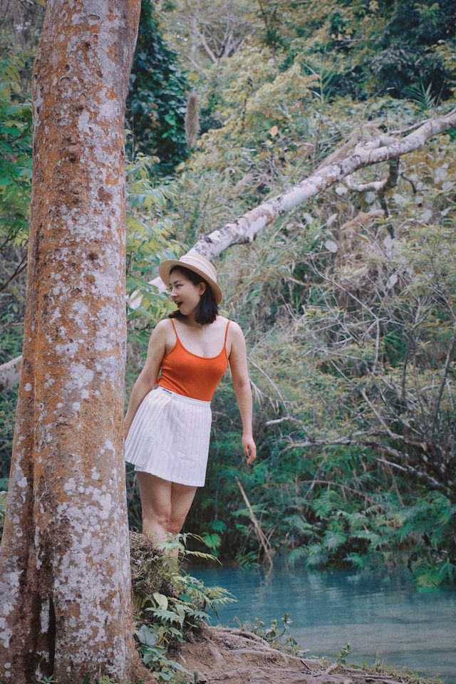 With a drone, see the panoramic view of Kuang Si Falls in Luang Prabang.