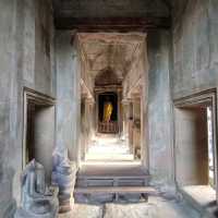 Climbing the tower of Angkor Wat