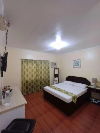 Twin Palm Guesthouse Отели в г. Давао дель Норте